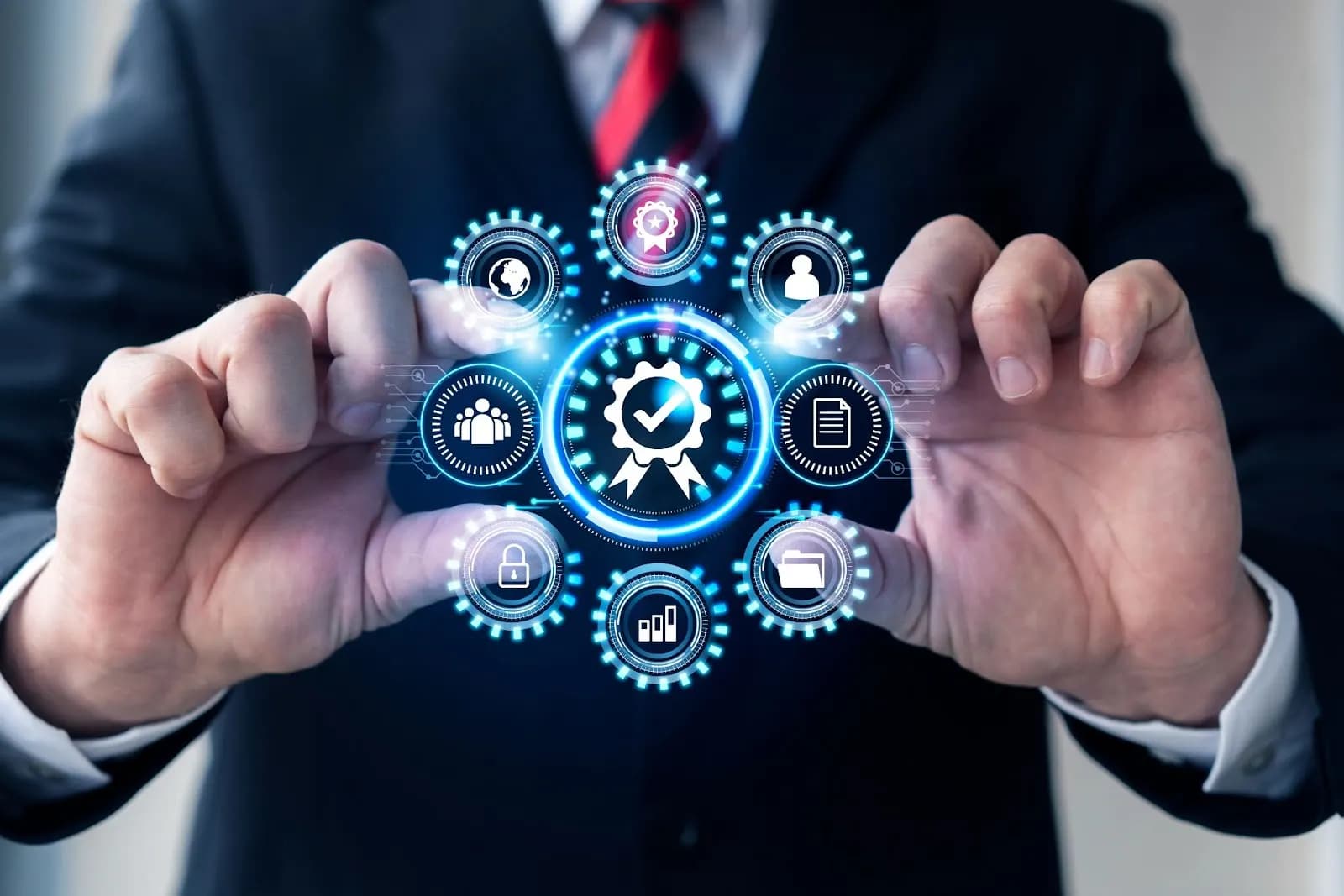 A businessman holding a unified digital interface with interconnected icons representing security, analytics, and quality assurance in a low-code system.