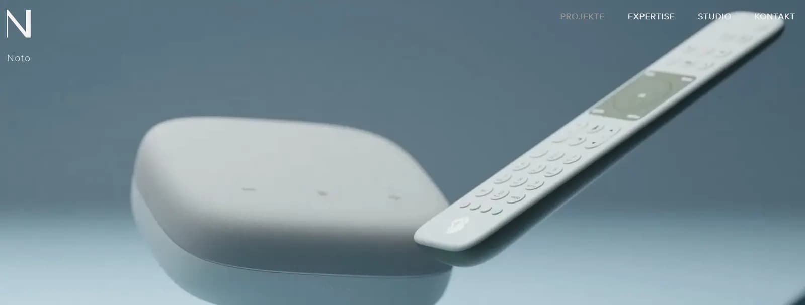 Noto Design portfolio example with a minimalist white remote control and smart home device